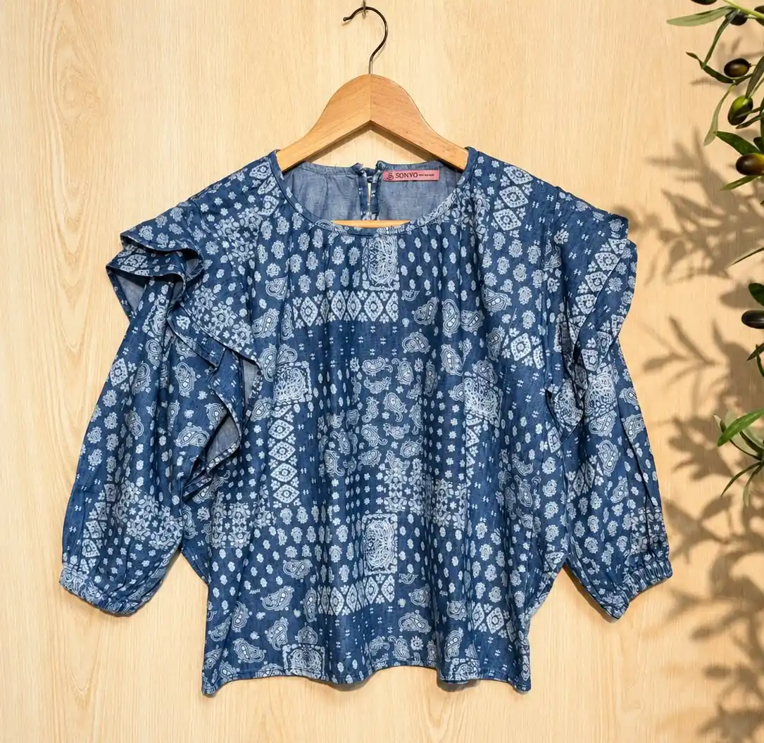 winter_top02_1250 Ruffled Shoulder Motif Printed Top - Image 1